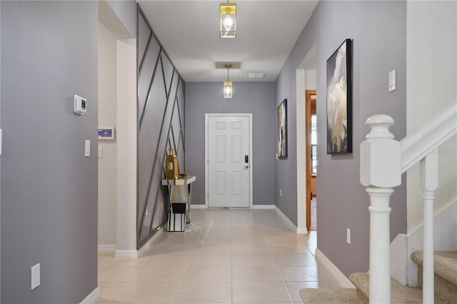 foyer entrance with light tile patterned flooring