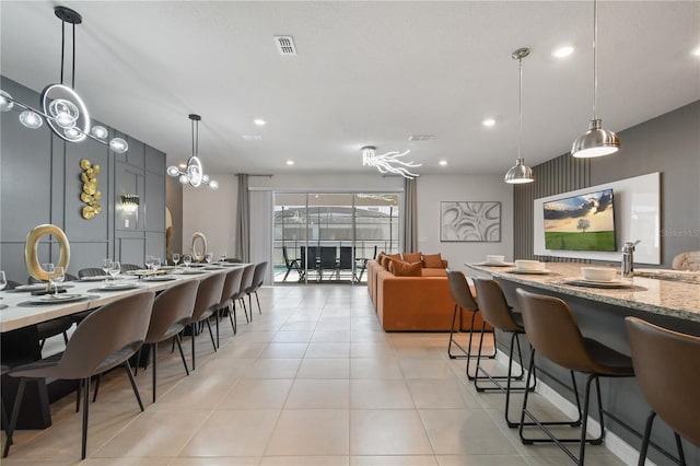 dining space featuring light tile patterned flooring