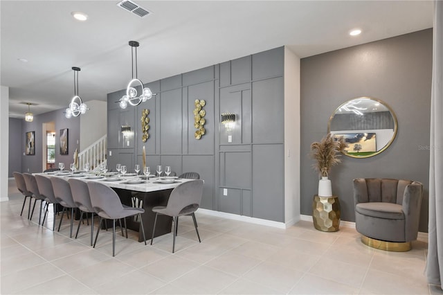 dining area featuring light tile patterned flooring