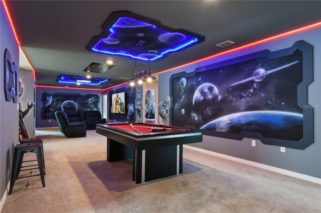 recreation room with pool table, a raised ceiling, and carpet