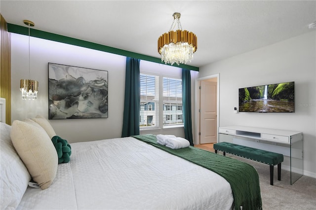 carpeted bedroom featuring an inviting chandelier