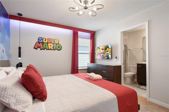 carpeted bedroom with connected bathroom, an inviting chandelier, and a textured ceiling