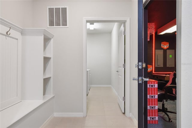 walk in closet featuring light tile patterned floors and electric panel