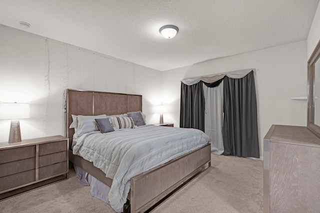 carpeted bedroom with a textured ceiling