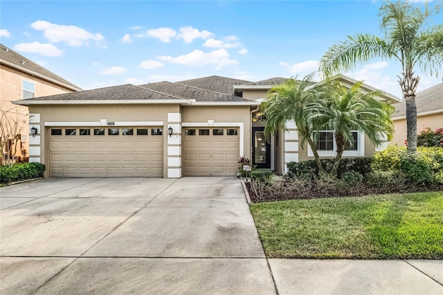 view of front facade featuring a garage and a front lawn