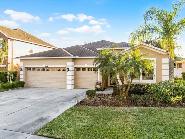 view of front facade featuring a garage and a front lawn