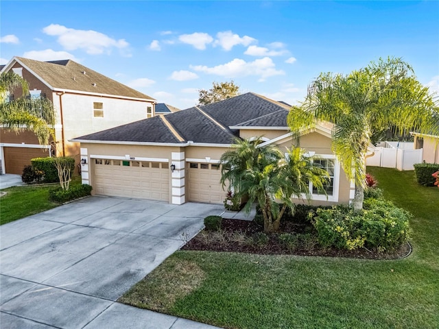 view of front facade with a garage and a front yard