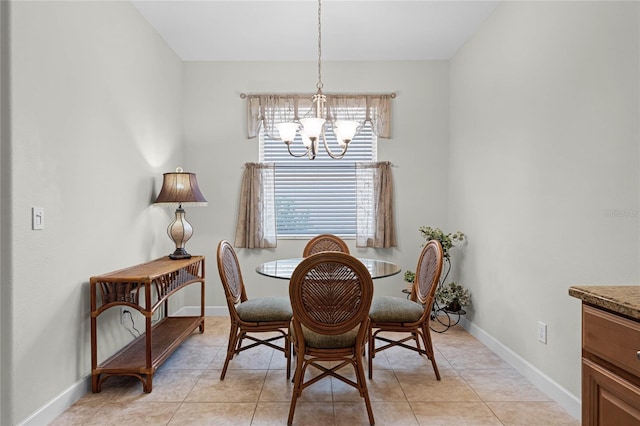 dining space with a notable chandelier and light tile patterned floors