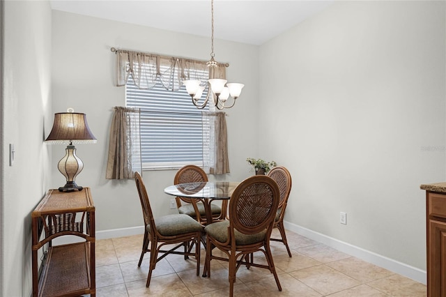 dining area featuring light tile patterned flooring and a chandelier