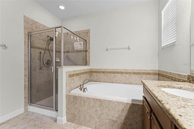 bathroom with vanity, tile patterned flooring, and independent shower and bath