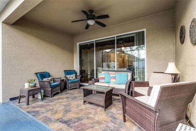 view of patio featuring an outdoor living space and ceiling fan