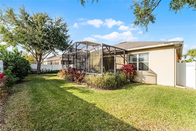 rear view of house with a yard