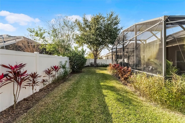 view of yard featuring a lanai