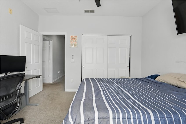 carpeted bedroom with a closet and ceiling fan