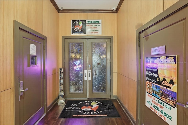 doorway to outside featuring ornamental molding, dark hardwood / wood-style flooring, and french doors