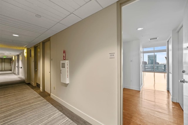 150 E Robinson St Unit 1214, Orlando, FL 32801 - hall featuring hardwood / wood-style flooring and floor to ceiling windows