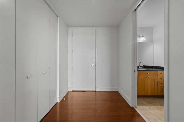 150 E Robinson St Unit 1214, Orlando, FL 32801 - hallway with sink and hardwood / wood-style flooring