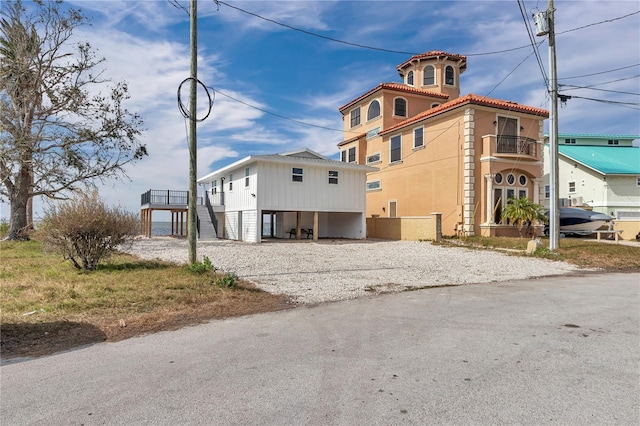 view of property exterior featuring a balcony