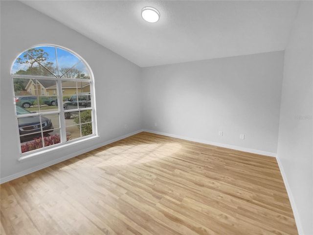 empty room with light hardwood / wood-style floors