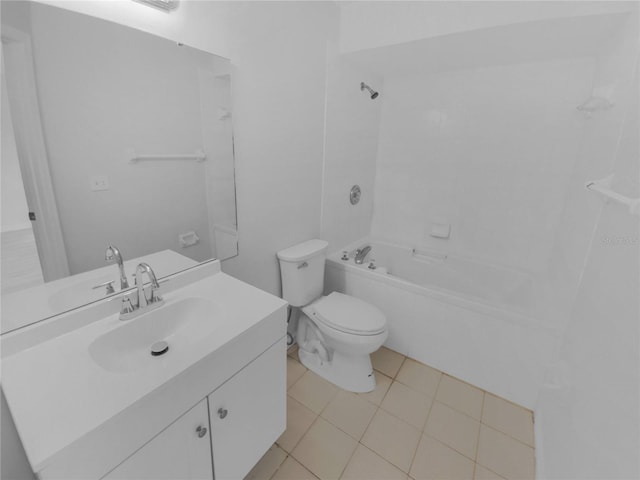 full bathroom featuring tile patterned floors, vanity, toilet, and tiled shower / bath combo