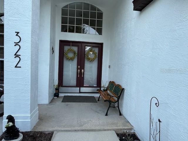 322 N Shadowbay Blvd, Longwood, FL 32779 - view of exterior entry featuring french doors and stucco siding