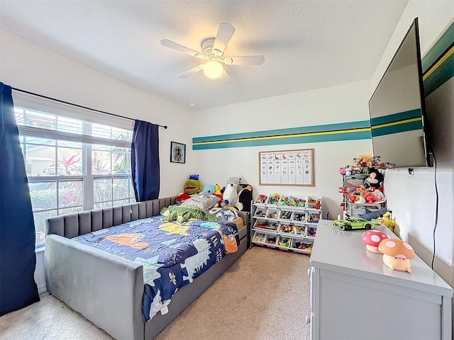 bedroom featuring ceiling fan and a textured ceiling