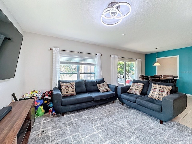 tiled living room with a textured ceiling