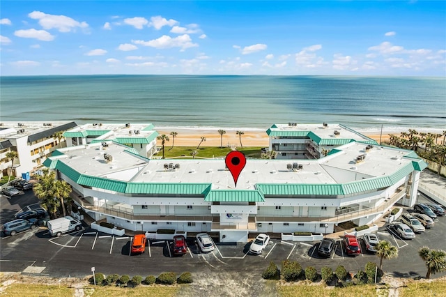 aerial view featuring a water view and a view of the beach