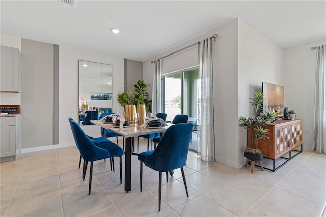 dining area with light tile patterned floors