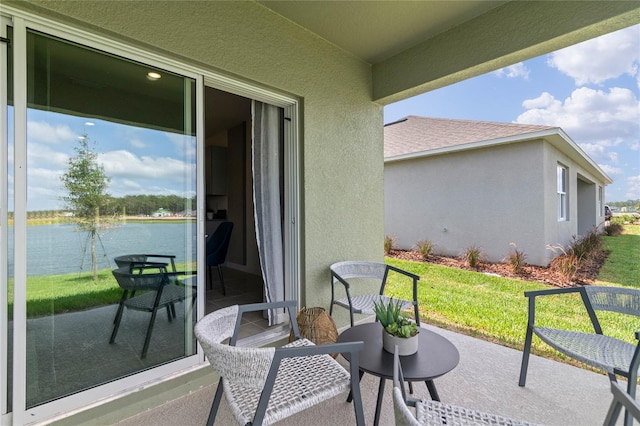 view of patio / terrace with a water view