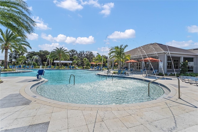 view of swimming pool with a patio area