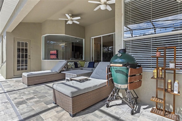 view of patio / terrace with an outdoor living space and a ceiling fan