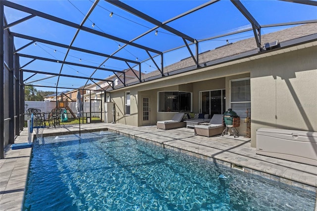 view of swimming pool featuring a fenced in pool, a lanai, a patio area, and fence