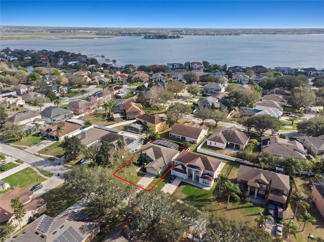 birds eye view of property featuring a residential view and a water view