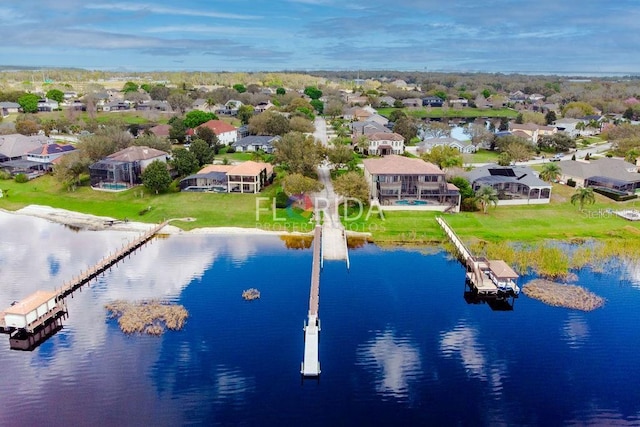 aerial view featuring a water view and a residential view