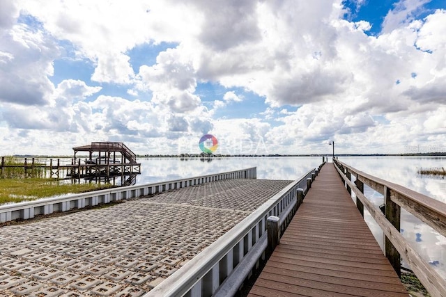 view of dock with a water view