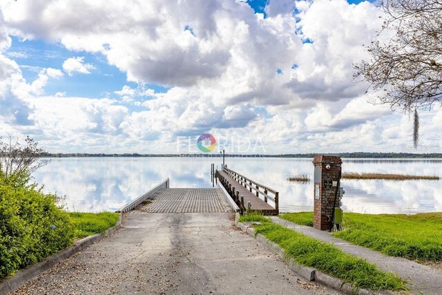 dock area with a water view