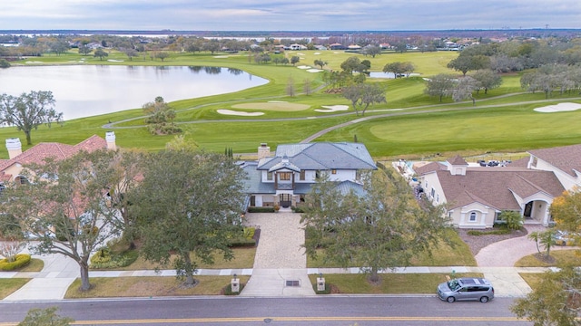 bird's eye view featuring a water view and golf course view