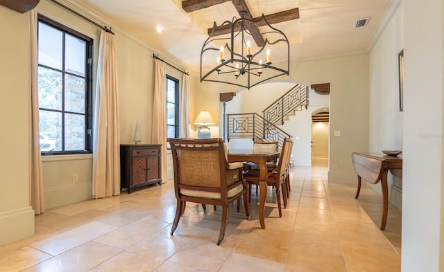 dining space with arched walkways, a chandelier, visible vents, baseboards, and crown molding