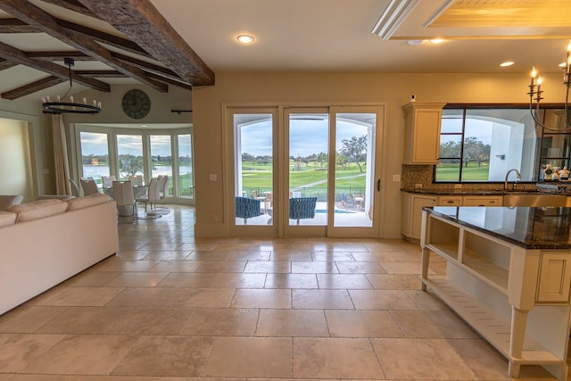 doorway to outside with a chandelier, recessed lighting, and a healthy amount of sunlight