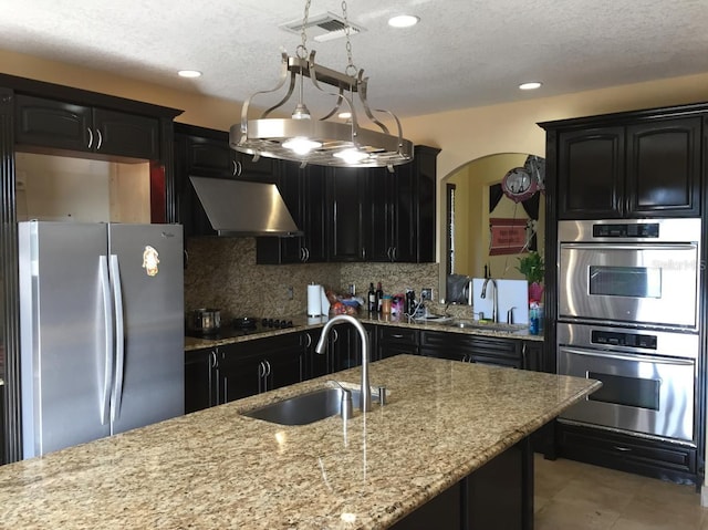 kitchen featuring tasteful backsplash, sink, and stainless steel appliances