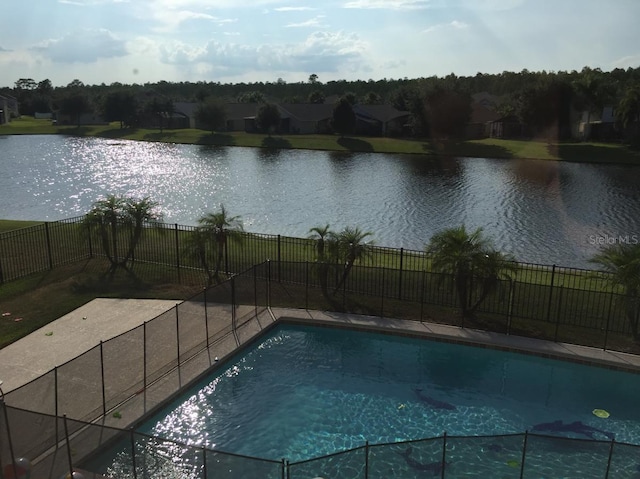 view of pool featuring a water view