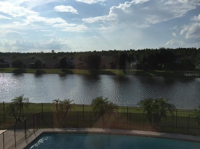 view of pool featuring a water view