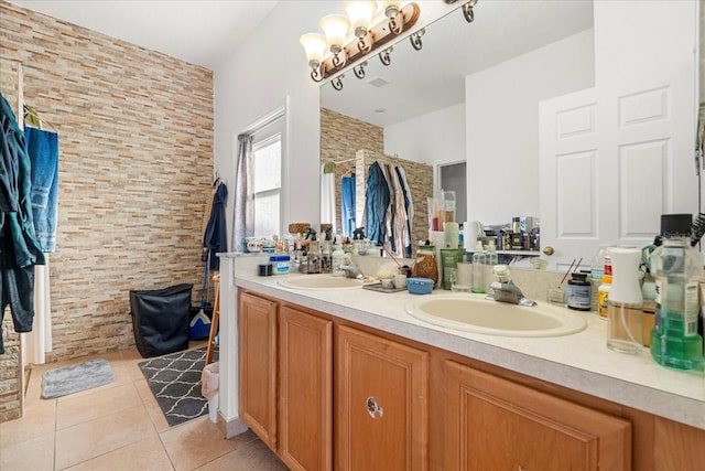 bathroom featuring double vanity, tile patterned flooring, and a sink