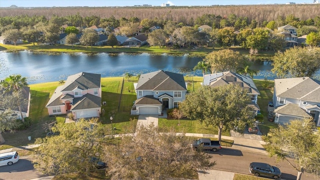 birds eye view of property featuring a water view and a residential view