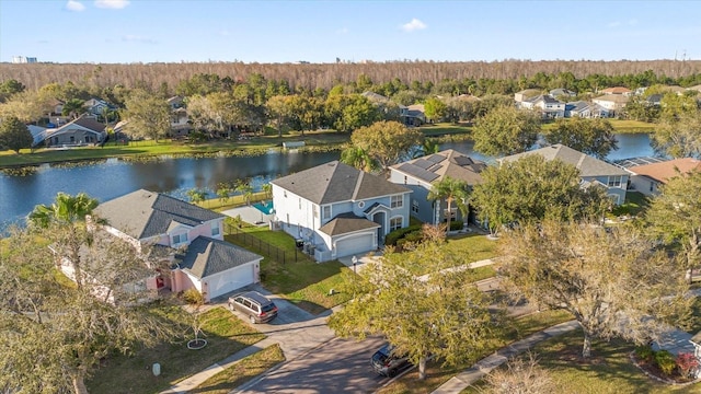 birds eye view of property featuring a water view and a residential view