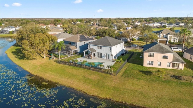 bird's eye view featuring a water view and a residential view