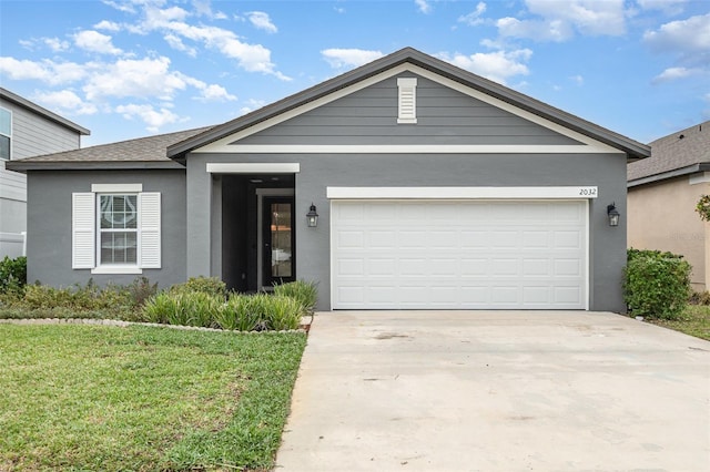 single story home featuring a garage, concrete driveway, a front lawn, and stucco siding