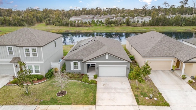 aerial view with a residential view and a water view