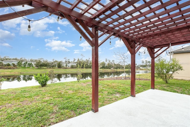 view of patio / terrace featuring a water view and a pergola